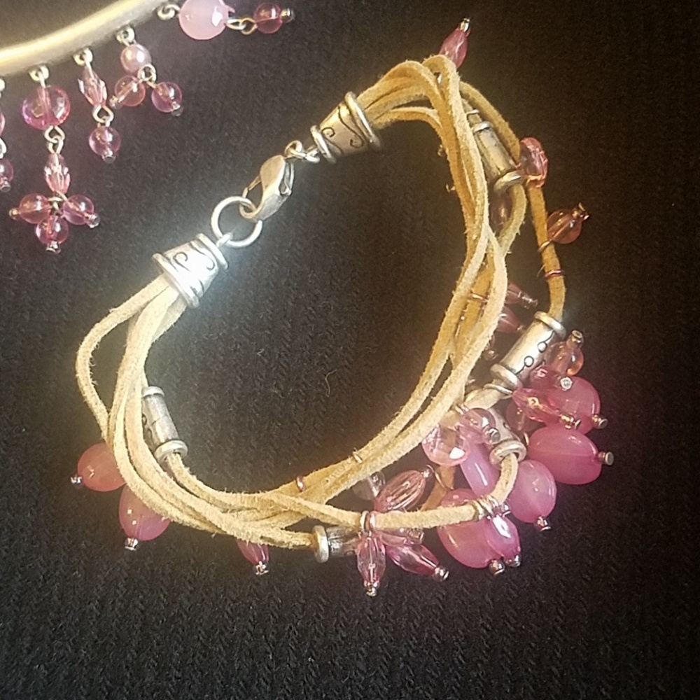 Pink  jewel set ..silver on  leather cord